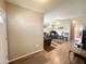 Bright living room with stylish seating, ceiling fan, and laminate flooring at 903 S Mineshaft Dr, Apache Junction, AZ 85119