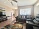Comfortable living room with neutral walls, ceiling fan, and cozy furniture with natural light at 903 S Mineshaft Dr, Apache Junction, AZ 85119