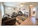 Comfortable living room with neutral walls, ceiling fan, and cozy furniture with natural light at 903 S Mineshaft Dr, Apache Junction, AZ 85119