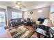 Comfortable living room with neutral walls, ceiling fan, and cozy furniture with natural light at 903 S Mineshaft Dr, Apache Junction, AZ 85119