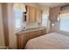Comfortable main bedroom with a ceiling fan and plenty of built in cabinet and storage space at 903 S Mineshaft Dr, Apache Junction, AZ 85119