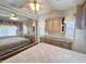 Comfortable main bedroom features a ceiling fan, plenty of built in cabinet and mirrored closet at 903 S Mineshaft Dr, Apache Junction, AZ 85119