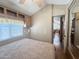 Comfortable main bedroom features a ceiling fan, plenty of built in cabinet and mirrored closet at 903 S Mineshaft Dr, Apache Junction, AZ 85119