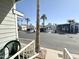 View from porch steps overlooking the community with mature palm trees at 903 S Mineshaft Dr, Apache Junction, AZ 85119