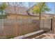 Charming backyard featuring modern fencing, a wooden bench, and lush trees at 920 S Ash Ave, Tempe, AZ 85281