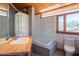 Bright bathroom with modern tile, wood vanity, and a sleek soaking tub at 920 S Ash Ave, Tempe, AZ 85281