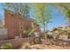 Sienna Court Lofts exterior view with brick walls, trees, and landscaping at 920 S Ash Ave, Tempe, AZ 85281