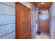 Front door leads into an entryway with brick walls and wood finishes at 920 S Ash Ave, Tempe, AZ 85281