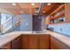 Modern kitchen with stainless steel sink, butcher block countertops, and wood cabinets at 920 S Ash Ave, Tempe, AZ 85281