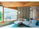 Bright living room with large windows, textured walls, wood ceilings, and comfortable seating area at 920 S Ash Ave, Tempe, AZ 85281