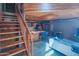 Modern staircase, living room and kitchen with hardwood ceiling, stainless steel appliances, and open layout at 920 S Ash Ave, Tempe, AZ 85281