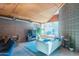 Living room featuring large windows, wood ceiling, and exposed brick details at 920 S Ash Ave, Tempe, AZ 85281