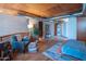 Stylish bedroom with exposed ductwork, a seating area, and convenient washer and dryer access at 920 S Ash Ave, Tempe, AZ 85281