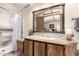 Bathroom featuring a spacious tiled shower, granite countertops, and well-lit vanity at 9828 E Pueblo Ave # 113, Mesa, AZ 85208