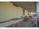 Inviting covered patio featuring outdoor table and chairs, ideal for relaxing or entertaining at 9828 E Pueblo Ave # 113, Mesa, AZ 85208