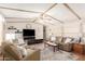 Cozy living room featuring comfortable seating, a ceiling fan, and an entertainment center at 9828 E Pueblo Ave # 113, Mesa, AZ 85208