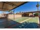 Outdoor shuffleboard court with covered seating, perfect for community recreation and social activities at 9828 E Pueblo Ave # 113, Mesa, AZ 85208