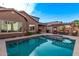 Serene backyard with pool, pergola, and lush landscaping perfect for relaxation at 10746 W Desert Elm Ln, Peoria, AZ 85383