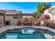 Backyard oasis with pool, spa, pergola, BBQ and desert landscaping at 10746 W Desert Elm Ln, Peoria, AZ 85383