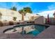 Backyard featuring a private pool, palm trees, and a storage shed at 10746 W Desert Elm Ln, Peoria, AZ 85383
