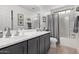 Well-lit bathroom with modern vanity, mirror, and shower-tub combination for convenience at 10746 W Desert Elm Ln, Peoria, AZ 85383
