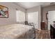 Inviting bedroom with wood floors, double closets and a comfortable bed at 10746 W Desert Elm Ln, Peoria, AZ 85383