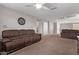 Inviting living room features plush sofas and neutral decor, creating a cozy gathering space at 10746 W Desert Elm Ln, Peoria, AZ 85383