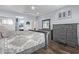 Beautiful main bedroom featuring neutral walls, wood floors and a modern bed at 10746 W Desert Elm Ln, Peoria, AZ 85383