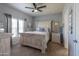 A serene bedroom with an inviting bed, soft lighting, and neutral decor providing a comfortable retreat at 11596 W Sierra Dawn Blvd # 293, Surprise, AZ 85378