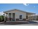 Inviting single-story home featuring a well-maintained exterior and covered parking area at 11596 W Sierra Dawn Blvd # 293, Surprise, AZ 85378