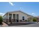 A well-maintained single-story home with a convenient covered parking area and cozy porch at 11596 W Sierra Dawn Blvd # 293, Surprise, AZ 85378