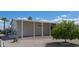 The home features an exterior with low maintenance landscaping and a carport at 11596 W Sierra Dawn Blvd # 293, Surprise, AZ 85378