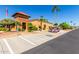 Charming golf carts parked by the clubhouse, adding convenience and leisure to community living at 11596 W Sierra Dawn Blvd # 293, Surprise, AZ 85378