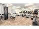 Bright gym area with carpet flooring with modern treadmills, weight training and fitness equipment, and natural light at 11596 W Sierra Dawn Blvd # 293, Surprise, AZ 85378
