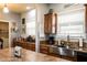 A view from the kitchen area, showcasing granite counters, stainless sink, cabinets and decor at 11596 W Sierra Dawn Blvd # 293, Surprise, AZ 85378