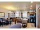 Spacious kitchen and dining area with warm wood cabinetry and ample counter space for cooking at 11596 W Sierra Dawn Blvd # 293, Surprise, AZ 85378