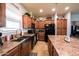 A kitchen featuring a center island, stainless steel sink, granite countertops and dark appliances at 11596 W Sierra Dawn Blvd # 293, Surprise, AZ 85378