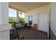 Inviting covered porch features comfortable seating and a welcoming entrance at 11596 W Sierra Dawn Blvd # 293, Surprise, AZ 85378