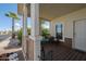 Cozy covered porch has comfortable seating and is perfect for enjoying the outdoors at 11596 W Sierra Dawn Blvd # 293, Surprise, AZ 85378