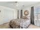 Comfortable bedroom featuring neutral walls, carpet, and a large decorative mirror at 1433 E Indian Wells Dr, Chandler, AZ 85249