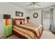 Cozy bedroom featuring carpet, side tables, and large windows at 1433 E Indian Wells Dr, Chandler, AZ 85249