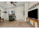 Inviting living room with a ceiling fan, and a mounted TV for entertainment at 1433 E Indian Wells Dr, Chandler, AZ 85249