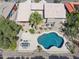 Overhead view of a house with a backyard pool and patio, desert landscaping, and privacy fence at 15755 E Palomino Blvd, Fountain Hills, AZ 85268