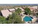 Scenic aerial view of a home with a pristine backyard pool, desert landscaping, and mountain views at 15755 E Palomino Blvd, Fountain Hills, AZ 85268