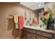Bathroom vanity with granite counters, fresh flowers, and stylish lighting fixtures at 15755 E Palomino Blvd, Fountain Hills, AZ 85268