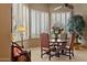 Bright dining area featuring shuttered windows and a round table with leather chairs at 15755 E Palomino Blvd, Fountain Hills, AZ 85268