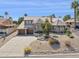 Beautiful two-story home with a tile roof, desert landscaping, and a spacious three-car garage at 15755 E Palomino Blvd, Fountain Hills, AZ 85268