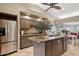 Bright kitchen showcasing stainless steel appliances, granite counters, and center island at 15755 E Palomino Blvd, Fountain Hills, AZ 85268