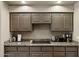 Close up of kitchen cooktop and granite countertops with wood cabinets at 15755 E Palomino Blvd, Fountain Hills, AZ 85268