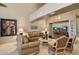 Cozy living room with neutral tones, comfortable seating, and large television in the background at 15755 E Palomino Blvd, Fountain Hills, AZ 85268